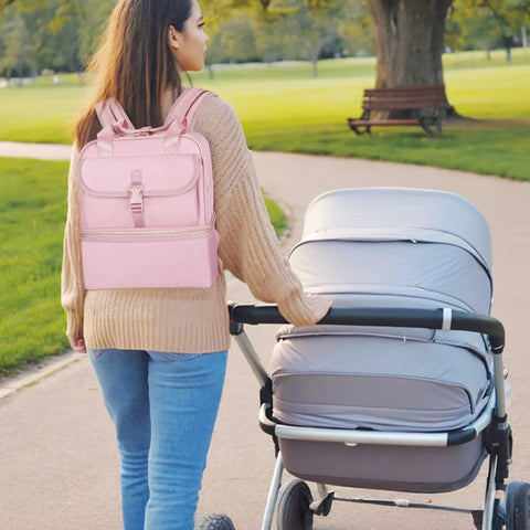 Woman walking with a pink Premium Breast Pump Bag Featuring An Insulated Cooler Compartment For Wearable Pumping Backpack.