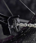 Go To Road Gravel MTB Bicycle Chain Cleaning Brush Three Sided Tool in use on a dirty bike chain showing tough bristles.