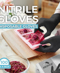 Person wearing black nitrile gloves handling materials on a wooden surface, 100 gloves box visible, product: Black Nitrile Gloves Powder Free 4 Mil Medium, Durable Disposable Gloves For Industrial And Home Use, Oil Resistant And Antistatic, High Sensitivity, Will Not Tear Easily, Ideal For Fine Work And Everyday Tasks