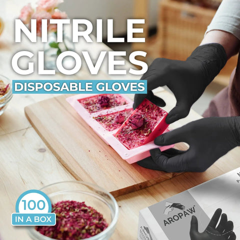 Person wearing black nitrile gloves handling materials on a wooden surface, 100 gloves box visible, product: Black Nitrile Gloves Powder Free 4 Mil Medium, Durable Disposable Gloves For Industrial And Home Use, Oil Resistant And Antistatic, High Sensitivity, Will Not Tear Easily, Ideal For Fine Work And Everyday Tasks