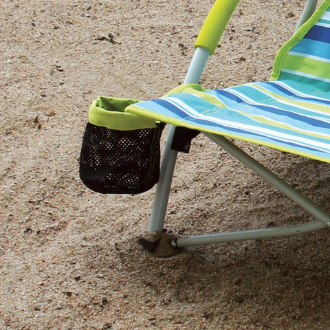 Close-up of Utopia Breeze Lightweight Beach Chair with cup holder on sandy ground, showing part of the durable steel frame.