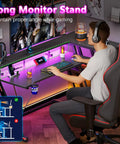 40 Inch L Shaped Gaming Desk With Power Outlet And LED Lights Carbon Fiber Textured Corner Computer Desk setup with user