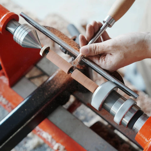 Crush Complex Turns On Your Lathe With This Badass ER32 Collet Chuck Kit Featuring Heavy Duty Base Five Precision Jaws in use with wooden pen mandrels on a lathe.