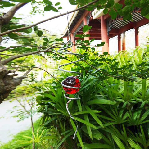 Gazing Ball Spiral Wind Spinner With Stainless Steel Tail, Hanging Swivel Hook, Weather Resistant Indoor Outdoor Decor In Silver And Red, 13 Inch Overall Height, 2 Inch Glass Ball, 2.5 Inch Spiral hanging in garden with red glass ball
