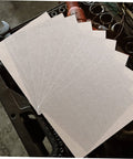 Heat Resistant Microwave Mica Sheet Set, 10 Pieces, on a workshop table, silver color, adjustable size, kitchen accessories