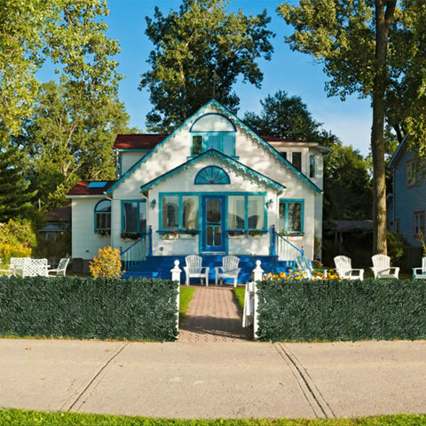 Faux Ivy Privacy Fence Panel For Outdoor Spaces Heavy Duty Hedge Screen With Realistic Leaves in front of a house
