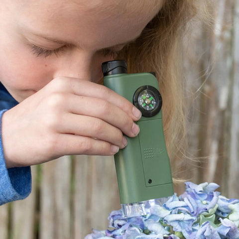 Kid Explorer 7 Function Optical Pocket Tool With 30x Microscope, 8x Telescope, 9x Fold Out Magnifier, Built In Flashlight, Signal Whistle, Compass And Digital Clock, Totally Fun Hands On Learning Gift For Curious Kids green pocket tool with compass, used on flowers