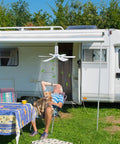 SCOOYEEES 17.7inch Portable Ceiling Fan USB Ceiling Fan Small Silent RV Fan hanging above a man relaxing outside a camper.