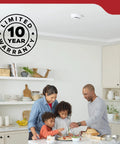 Family cooking in a kitchen with No Sweat Battery Operated Smoke Detector With Ultra Fast Sensing Plus A Beast Mode Eighty Five Decibel Alarm.