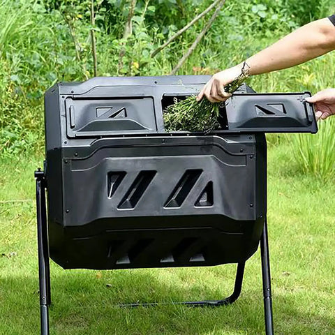 Outdoor Tumbling Composter 43 Gallon Dual Chamber With Black Door Fast Assembly Rotating Compost Bin in use in a backyard.