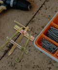 Heavy Duty Carbon Steel Two Jaw Gear Bearing Puller With Reinforced Grips positioned on work surface with screws nearby.