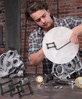 Mechanic using Anti Walk Rotation Pins Kit For Precision Machines And Motorcycles in a workshop setting