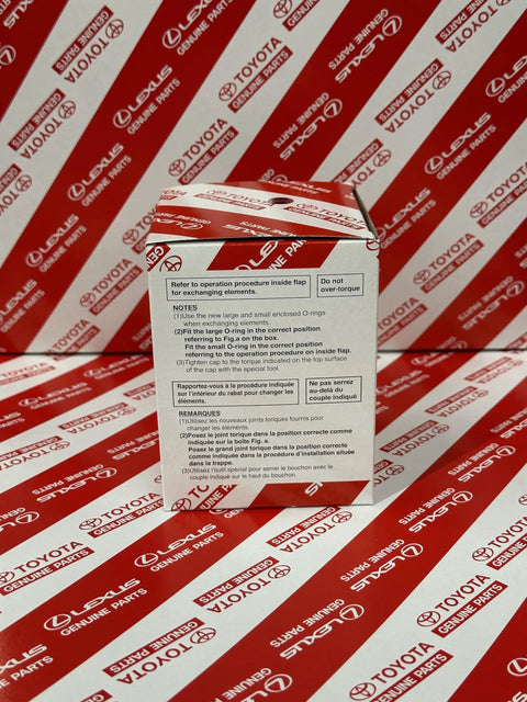 Box of Lexus Engine Oil Filter 04152-YZZA3 Genuine OEM with instructions visible, on branded Toyota Lexus background