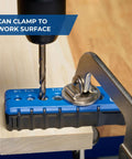 Front view of blue Kreg portable drilling guide with six hardened drill guides clamped to a work surface.