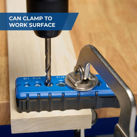 Front view of blue Kreg portable drilling guide with six hardened drill guides clamped to a work surface.