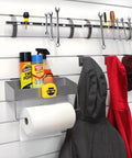 All In One Slatwall Organizer Kit For Panels With Solid Shelf Paper Towel Holder Three Ball Tipped Coat Hooks And Two Magnetic Tool Holders in use