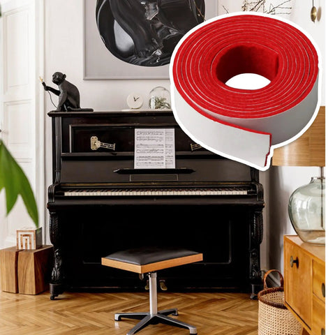 Red and white replacement piano spring rail felt next to a black upright piano, premium pressed felt for keyboard maintenance.