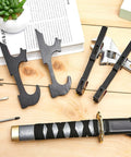 Sword Wall Mount Hanger Set For Adjustable Display Rack For Samurai Swords, 4 pieces, black hardware with tools on wooden surface.