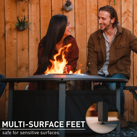 People sitting by 42 Inch Fire Pit Surround Tabletop Shield For Wood Burning Pits, Portable Protective Barrier with flame visible