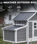 Gray 82 Inch Wooden Chicken Coop For 2 To 3 Hens Backyard Hen House With Nesting Box in rain showcasing all-weather roof design