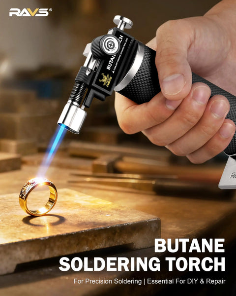 Hand using Dual Flame Butane Torch Lighter For Cooking And Soldering Refillable Kitchen Torch For Pro Grade Cooking with ring