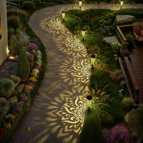 Pathway illuminated by Six Pack Solar Outdoor Garden Lights With Mandala Pattern, Warm Amber Glow, Waterproof Pathway Landscape Lights