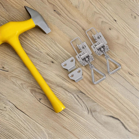 Heavy Duty Toggle Clamp Latch With Adjustable Lock Hole Stainless Steel Kit on wooden surface with yellow hammer beside.