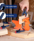 Person using 16 Piece Nylon Spring Clamp Set With 3 3/8 Inch Adjustable Jaw Pads for woodworking on an orange vise.