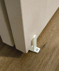 4 Pack Universal ABS Sliding Closet Door Floor Guides for 1-3/8 Inch Thick Doors White Bottom Guides With Screws Keeps Sliding Panels Centered On Tracks Provides Side Support For Cabinet And Closet Door Systems installed view