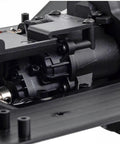 Close-up of One Tenth Scale RC Crawler Chassis Kit with 313mm wheelbase, showing nylon frame and 2-speed gearbox.