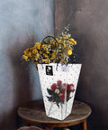 Plastic Flower Bouquet Tote Bag With Handy Handle For Floral Arrangements And Gift Packaging on wooden table