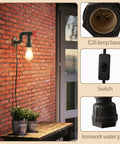Water Pipe Wall Light Fixture Vintage Steampunk Sconce with plug-in cord, E26 base, switch, installed on brick wall in cafe setting.