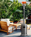 Heavy Duty 50,000 BTU Propane Patio Heater for Outdoors in a backyard with wooden chairs and greenery