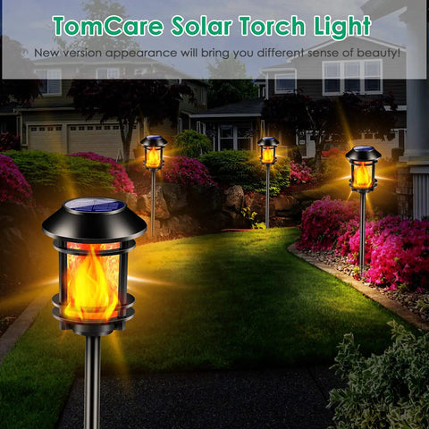 Outdoor Solar Torch Lights With Flickering Flame illuminating a garden pathway, showcasing realistic flame effect for ambience.