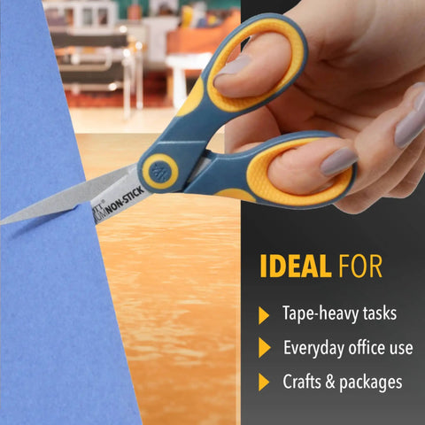 5-Inch Non-Stick Titanium Scissors With Glide Adjust Technology in use cutting blue paper in yellow and gray