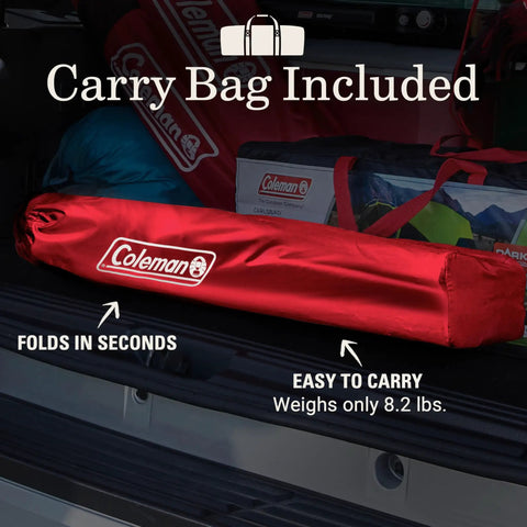Portable Camping Chair With Built In Four Can Cooler in red carry bag on car trunk, demonstrating easy portability.