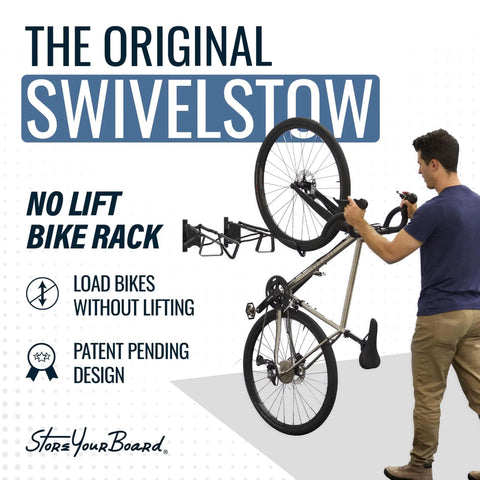 Man using Two Pack Wall Mount Bike Rack Set For Garage Storage Holds Two Mountain Bikes Up To 70 Lb Each No Lift Vertical Hanger For Quick Access And Space Saving Heavy Duty Steel.