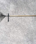 Two Pack Heavy Duty Black Aluminum Pool Pole Hangers With Screws Sturdy Hooks installed holding a rake on a wall