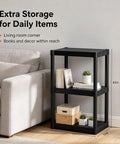 Tough As Nails 3 Tier Plastic Storage Shelves in living room, freestanding black organizer holding books and decor.
