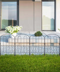 28 Pack Decorative Garden Fence Panels Outdoor Yard Friendly 24 Inch High 13 Inch Wide 30 Feet Long Coated Metal Rust Proof Wrought Iron Wire Border Folding Patio Fences For Flower Beds Animal Barrier Landscape Decor Easy Setup installed in front of a modern patio with potted plants and greenery