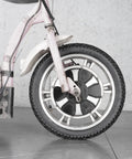 Close-up of front wheel showing the 16-inch bike tire with inner tube on a motorcycle, part of the Sixteen Inch Bike Tire With Inner Tube Set 16X2.125 For Electric Bicycles Motorcycles And Most Kids Bikes Heavy Duty Tubes Ride Ready With Wide Compatibility Including RoyalBaby Joystar Dynacraf.