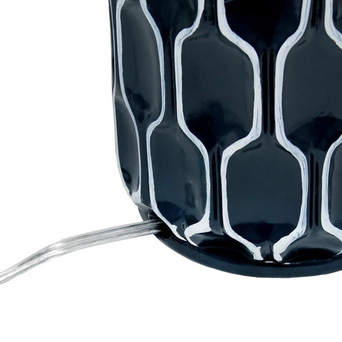 Close-up of handpainted white pattern on blue ceramic base of Blue Ceramic Table Lamp With Handpainted White Pattern, White Fabric Shade.