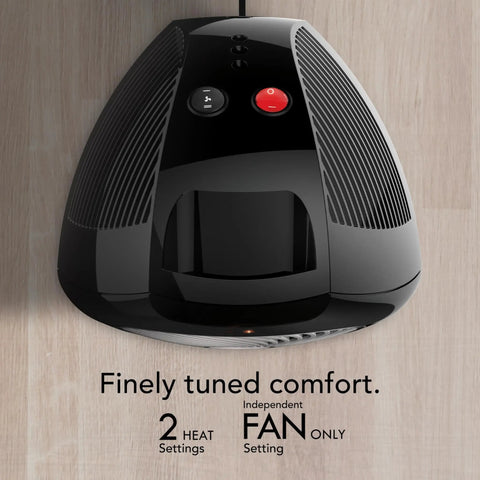 Top view of Compact Personal Space Heater With Vortex Heat Circulation, showing controls and sleek black design on wood surface.
