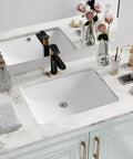 Top Shelf White Fireclay Undermount Bathroom Sink Rectangle 18X13 Inch on marble countertop with modern black faucet.