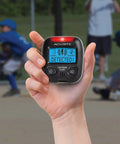 Hand holding Portable Lightning Detector With 25 Mile Storm Alert Audible Alarm Text Alerts Strike Counter Estimated Distance To Storm And Backlit Display For Easy Night Viewing.