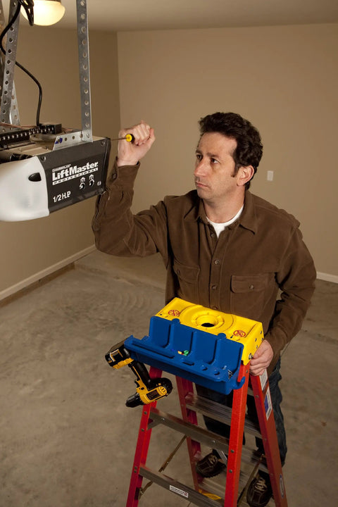 Man using Blue Ladder Accessory Kit with Open Storage Channel and Utility Hooks for 6000 6100 6200 6300 Series Stepladders