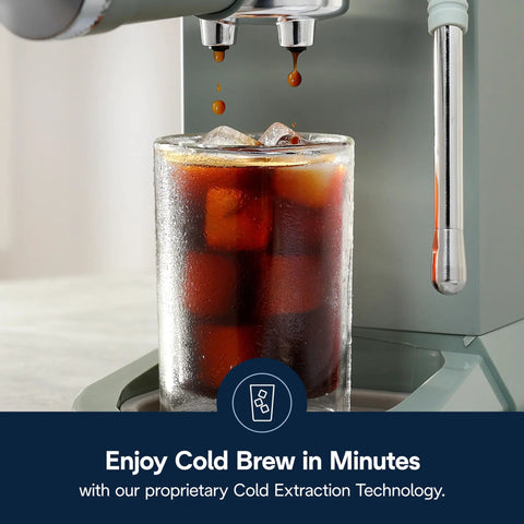 Compact Espresso Machine And Cold Brew Coffee Maker With Adjustable Milk Frother Wand For Smooth Hot Iced Lattes And Bold Cappuccinos making cold brew over a glass filled with ice.