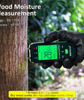 Pin Type Wood Moisture Meter For Hardwood And Softwood With Replaceable Probes in hand measuring wood
