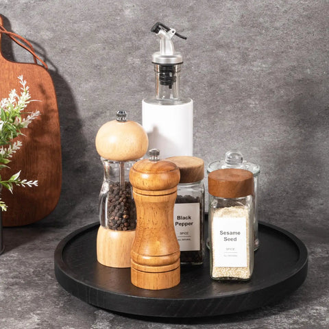 Premium Wood Lazy Susan Turntable Functions As Slick Kitchen Game Changer With Smooth Swivel Glide Waterproof 11 Inch Black Round Serving Tray with spices.