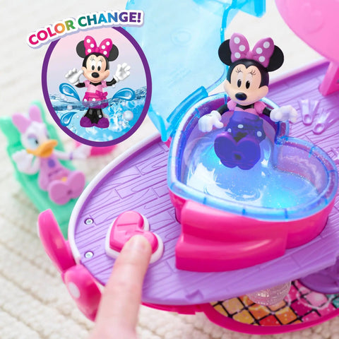 Minnie Mouse Bowdazzling Yacht Lights And Sounds Playset with color change feature, showing Minnie in a heart-shaped seat on pink yacht.